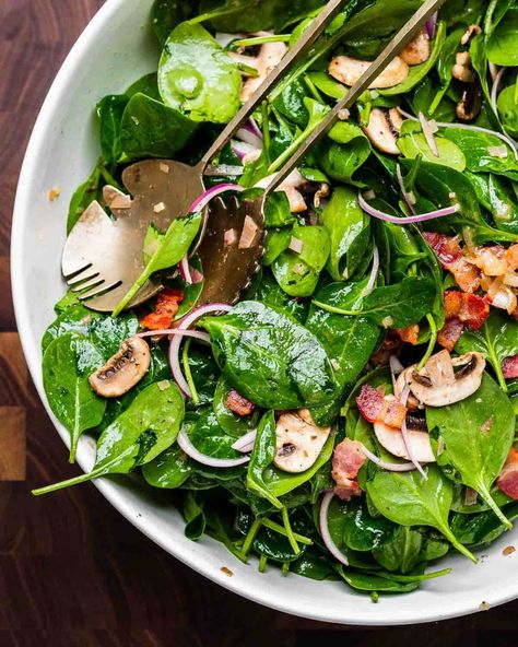 Spinach salad with hot bacon dressing combines baby spinach, crispy bacon, sliced red onion, and mushrooms tossed together with a hot honey Dijon bacon dressing. This salad is a hit at gatherings but is equally great for weeknights at home. #spinachsalad #spinachandbaconsalad #saladrecipes Hot Spinach Salad With Bacon, Warm Spinach Salad With Bacon, Spinach Mushroom Salad, Wilted Spinach Salad With Bacon Dressing, Spinach Salad With Hot Bacon Dressing, Warm Bacon Dressing For Spinach Salad, Hot Bacon Dressing For Spinach Salad, Spinach Salad With Warm Bacon Dressing, Wilted Spinach Salad With Bacon