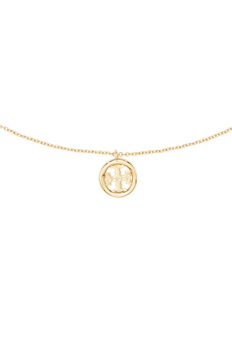 A dainty logo medallion serves as a pretty focal point for this delicate goldtone necklace. 15" length; 2" extender; 3/8"W x 1/2"L pendant Goldtone plate/moonstone Imported Gold Classy Necklace, Light Gold Jewelry, Timeless Luxury Gold Medallion Necklace, Cute Dainty Necklaces, Cute Gold Pendant Charm Necklace, Jewelry Inspo Necklaces, Dainty Logo, Everyday Gold Necklace, Tory Burch Set Jewelry