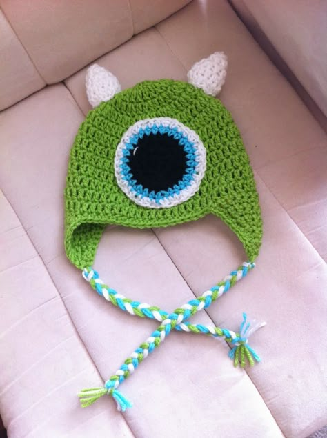 The past few months my days have consisted of having Monsters Inc. and Monsters University playing back to back on the TV. For some reason K... Crochet Mike Wazowski, Disney Crochet Hats, Monsters Inc Crochet, Earflap Hat Pattern, Crochet Monster Hat, Crochet Monster, Crochet Character Hats, Boys Hats, Monster Hat