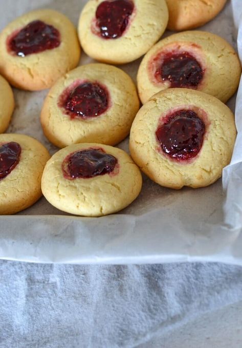 Soft and buttery vanilla biscuits with a lovely sweet jam centre, these easy jam drop biscuits are a classic, old fashioned afternoon tea favourite. Raspberry Biscuits, Biscuits Drop, Jam Drop Biscuits, Jam Drops, Easy Jam, Vanilla Biscuits, Thumbprint Cookies Recipe, Pantry Ingredients, Drop Biscuits