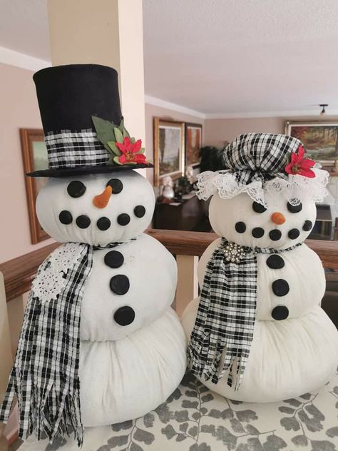 Made a Mr & Mrs Snowman I absolutely love them. No arms yet looking for the right sticks.  What do you think. Update  I've had a lot of you ask how I did I'd. Here's the instructions:.  Full circles are 18" 15" & 12" I put a small bag of rocks in the bottom and a wooden dowel then stuffed each circle until I couldn't stuff anymore. The  boys hat  is a large can of tomatoes with cardboard on the bottom. Girls hat I believe is a 12" circle I sewed lace around the edge then did a running stitch abo Mrs Snowman, Boys Hat, Diy Snowman, Gnomes Crafts, Holiday Crafts Christmas, Snowman Crafts, Snowman Ornaments, Christmas Wall Decor, Running Stitch