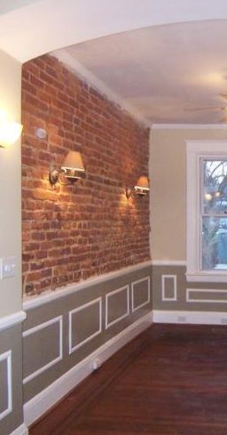 Exposed brick with crown moulding. Partial Brick Wall Interior, Brick Wallpaper With Picture Rail, Brick Wall With Crown Molding, Brick And Wainscotting Wall, Panelled Walls And Brick, Faux Brick Wall With Wainscoting, Exposed Brick With Panelling, Exposed Brick Walls Cottage, Exposed Brick Interior