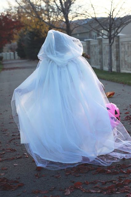 Turn tulle into a spooky specter costume this Halloween! Learn how in the DIY Ghost Costume. Tulle Cape Diy, Toddler Ghost Costume Girl, Light Up Ghost Costume, Diy Ghost Costume, Ghost Costume Women, Toddler Ghost Costume, Ghost Costume Kids, Vampire Costume Diy, Pirate Costume Diy