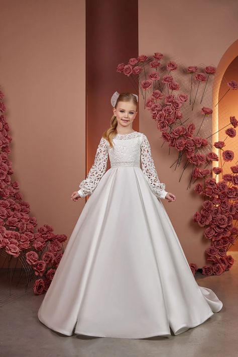 Make your little one's special day even more magical with our Enchanting Elegance Communion Dress. This exquisite dress is designed to create a lasting impression, capturing hearts with its timeless charm and attention to detail. Crafted from the finest materials, our Communion Dress features a delicate lace bodice that adds a touch of grace and sophistication. First Communion Dresses Catholic, Comunion Dress, Dress With Bishop Sleeves, Holy Communion Dresses, First Communion Dress, Dress For Wedding, Girls Couture, Full Length Skirts, Communion Dresses