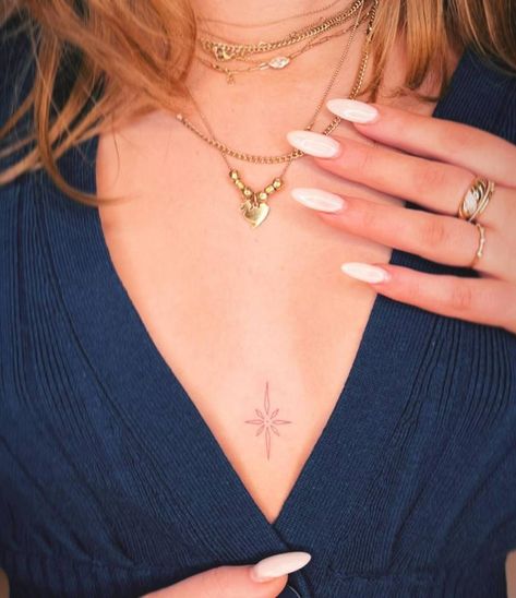 Fine line north star tattoo located on the sternum. Star Tattoos Sternum, Sternum Fine Line Tattoo, 8 Pointed Star Tattoo Bryce, Compass Sternum Tattoo, Sternum Tattoo Dainty, Sternum Tattoo Fine Line, Fine Line Sternum Tattoo Women, Sternum Star Tattoo, Tattoo Between Breast Simple