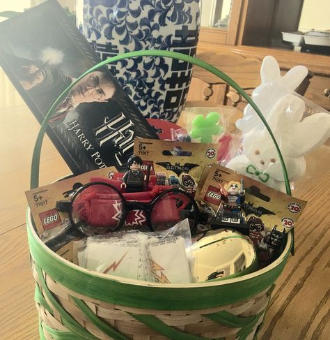 Harry Potter, LEGO Batman inspired Easter Basket. Wand, glasses and scar tattoo, golden egg, and then there's LEGO BATMAN!! Why can't he like candy! Harry Potter Easter Basket, Easter Baskets Ideas, Fun Easter Ideas, Boys Easter Basket, Harry Potter Lego, Batman Inspired, Scar Tattoo, Baskets Ideas, Raffle Baskets