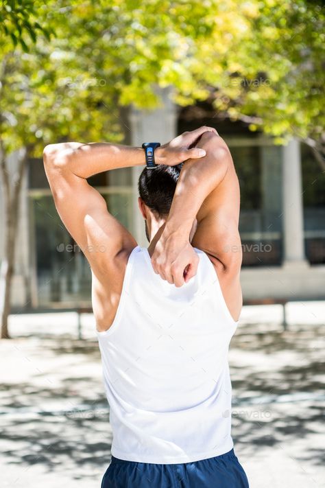 Rear view of athlete stretching his arm in the city by Wavebreakmedia. Rear view of athlete stretching his arm in the city #Affiliate #athlete, #view, #Rear, #stretching Stretching Poses Reference Male, Men Stretching Reference, Guy Stretching Reference, Arm Stretching Pose Reference, Stretching Arms Pose Reference, Male Stretching Pose Reference, Man Stretching Reference, Guy Stretching, Stretches For Men