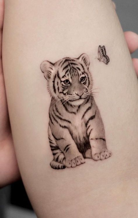 best tiger tattoos 2023 Tiger Cub Tattoo, Tiger Tattoo Meaning, Lion Cub Tattoo, Cub Tattoo, White Tiger Tattoo, Pixie Tattoo, Owl Tattoo Drawings, Kitten Tattoo, Cubs Tattoo