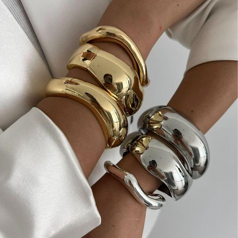 Discover timeless elegance with our Vintage Geometric Metal Cuff Bangles, a must-have accessory for anyone who loves to blend classic charm with contemporary style. Available in both stunning gold and sleek silver, these bangles are designed to make a statement with their distinctive geometric patterns that reflect a perfect balance of vintage allure and modern sophistication. Crafted from high-quality metal, each cuff bangle is expertly designed to ensure durability and a comfortable fit. The g