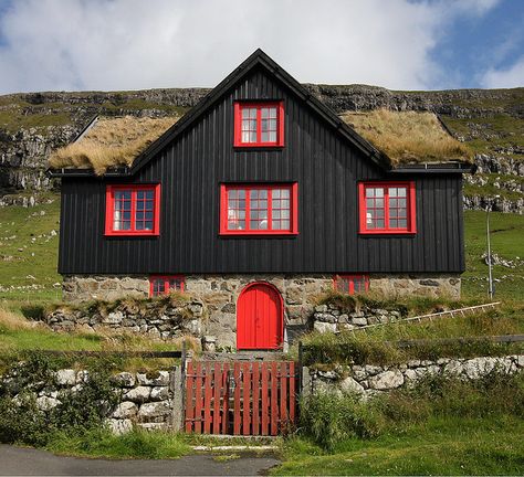 Black house, red windows, grass roof - the stereotypical Faroese building. This one is located near the old cathedral, SW of Tórshavn, Faroe Islands. Black Siding, Cabin Colors, Sod Roof, Red Windows, Grass Roof, Kingdom Of Denmark, Black Houses, Front Facade, Cozy Cabins