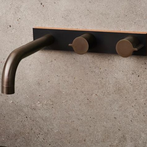 The Q Wood collection by ParTaps in collaboration with Wood Melbourne. Brass tap handles and spout mounted offset on a single black and timber backplate; timeless bathroom materials with a classic Melbourne palette.   This notice applies to the following finishes: • Antique Bronze • Rumbled Brass • Raw Brass • Brushed Brass • Native Brass • Burnished • Antique Copper • Brushed Copper • Bright Copper chemically induced “natural” “living” finish..this finish will darken and patina..vary and alter Bathroom Materials, Timber Kitchen, Brass Shower Head, Timeless Bathroom, Concrete Bathroom, Brass Tap, Bright Copper, Brass Shower, Custom Plates