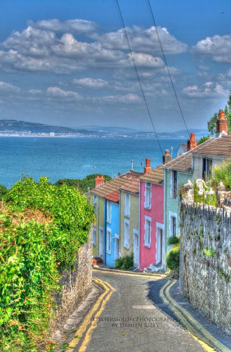 Colorful row houses in The Mumbles by Oystermouth Photography. South Wales Aesthetic, Swansea Bay, Wales Holiday, Swansea Wales, Gower Peninsula, Row Houses, Visit Wales, Swansea City, Cheap Flight