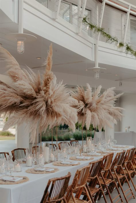 wedding reception photos, wedding photos, wedding photography, wedding photo shot list, boho wedding decor, wedding photo inspo, beach boho wedding, beachy boho wedding, boho wedding reception, boho wedding reception tables, pampas grass centerpieces, modern wedding decor Boho Wedding Fairy Lights, Table Settings Boho Wedding, Boho Chic Reception Decor, Boho Reception Centerpieces, Pampas Grass Reception Decor, Modern Boho Wedding Centerpieces, Boho Wedding Chairs, Pampas Wedding Table Decor, Pompass Grass Table Decor