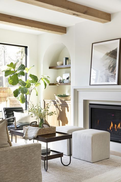 Favorite Fireplace Surrounds Just in Time for Cozy Season | Jkath Design Build Reinvent Jkath Design, Cast Stone Fireplace Surround, Cast Stone Fireplace, Stone Fireplace Surround, Natural Stone Fireplaces, Airy Room, Modern Color Palette, Brick Fireplace, Living Room With Fireplace