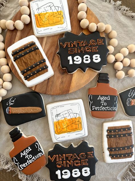 Decorated sugar cookies whiskey theme Whiskey Theme Cookies, Whiskey Glass Cookies Decorated, Bourbon Themed Cookies, 50th Birthday Bourbon Theme, Aged To Perfection Cookies Decorated, Bourbon Cookies Decorated, Whiskey Cookies Decorated, Whiskey Party Decorations, Whisky Cookies