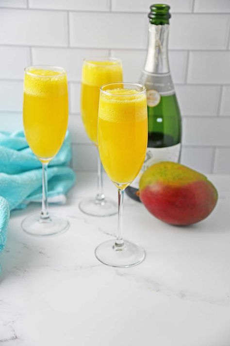 Mango Mimosa Recipe, Mango Mimosa, Mimosa Recipe, Bottle Of Champagne, Mango Margarita, Peach Puree, Mango Chunks, Lazy Weekend, Mango Puree