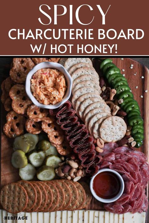 Hot honey is having a moment and it found its way on this spicy charcuterie board! Aside from the hot honey, this board has peppered salami, spicy pickles, pimento cheese, jalapeños, and more. Keep a glass of water nearby and dive in! See the blog for step by step instructions on recreating this charcuterie board. Spicy Charcuterie Board, Peppered Salami, Seasoned Nuts, Pretzel Thins, Best Pickles, Spicy Pickles, Salted Nuts, Pickle Slices, Charcuterie Inspiration