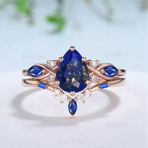 "Vintage Lapis Lazuli Wedding Ring Set 14k Rose Gold Pear Shaped Lapis Lazuli Engagement Ring Set Unique  Floral Blue Sapphire Bridal Ring Set Women ≫≫ Item Details  Make every ring to order, all rings are handmade in the United States.  Metal: Solid 10K & 14K & 18K Gold  Gold Color: Rose gold, Yellow gold, White gold ➽ Center Stone 6x8mm pear  cut natural Lapis Lazuli ➽ Accent Stone:lab created blue sapphire and moissanite Matching band:  lab created blue sapphire and moissanite Services: Custo Blue And Gold Ring, Engagement Ring Ideas, Lapis Lazuli Engagement Ring, Sapphire Wedding Ring Set, Floral Wedding Ring, Pretty Engagement Rings, Sapphire Engagement Ring Set, Unique Engagement Ring Settings, Amethyst Ring Engagement