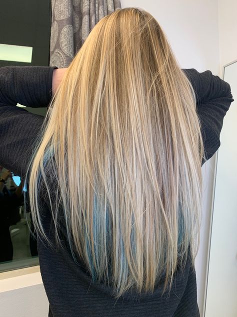 Blue peek a boo highlights in a blonde balayage🧜🏼‍♀️ Blonde Hair With Blue Underneath Highlights Underneath, Honey Blonde Hair With Blue Highlights, Subtle Blue Highlights In Blonde Hair, Light Blue Hair Underneath, Peekaboo Color On Blonde Hair, Turquoise Highlights In Blonde Hair, Blond Hair With Blue Underneath, Teal Streaks In Blonde Hair, Blue Under Blonde Hair