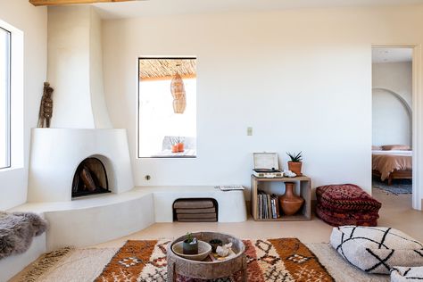 Home Tour: A Mediterranean and Southwest-Inspired Joshua Tree Abode - Sunset - Sunset Magazine Adobe Fireplace, Residential Neighborhood, Hot Tub House, Pool And Hot Tub, Cle Tile, Large Baths, Desert Homes, Moroccan Pillows, Vacation Home Rentals