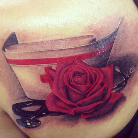 My nurse tattoo, done by the talented Danika at Newport tattoo  Nurse hat cap, stethoscope realistic rose Nurse Tattoo Ideas, Medical Tattoo Nurse, Amazing Tattoo Ideas, Tech Tattoo, Our Mindful Life, Nurse Tattoo, Medical Tattoo, Sweet Tattoos, Geniale Tattoos