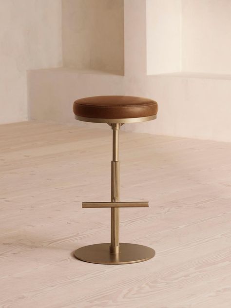 Our Wardell stool features a round, rotating seat in supple leather, detailed with double-top stitching. Inspired by Soho House Hong Kong, this counter stool has a fixed height central column with fluted detail, which descends to a T-bar footrest in a contemporary brass finish. Soho Home Wardell Counter Stool, Leather, Chestnut | Counter Stool, 63cm x 39cm Quilted Curtains, Soho Home, Vanity Accessories, Leather Frames, Bathroom Vanities For Sale, Crystal Glassware, Armchair Furniture, Soho House, Glassware Collection