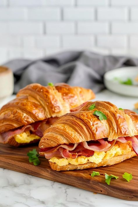 This easy croissant breakfast sandwich is loaded with fluffy eggs, crispy bacon, and gooey cheese. It's a classic combo that always satisfies. Hispanic Breakfast, Bacon Cheese Sandwich, Croissant Breakfast Sandwiches, Egg Croissant, Breakfast Cravings, Croissant Breakfast Sandwich, Leftover Breakfast, Breakfast Croissant, Bacon Crisps