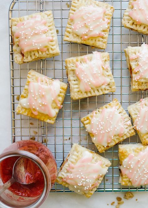 Rhubarb Pop-Tarts by Wood and Spoon blog. This recipe is for mini square hand pie breakfast pastries filled with a quite homemade rhubarb compote jam and a honey glaze icing. The hand pies can be made in advance and batches. These make fun morning treats or desserts. Learn how to DIY make from scratch pop-tarts here with simple pie dough and jelly on thewoodandspoon.com Homemade Pop Tarts Recipe, Pie Breakfast, Simple Pie, Morning Treats, Poptart Recipe, Glaze Icing, Rhubarb Compote, Make From Scratch, Rhubarb Jam