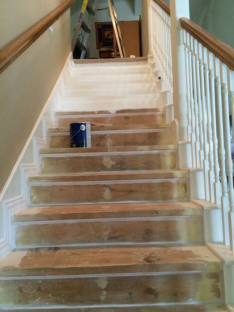 This is one way to update a boring staircase we wish we'd seen sooner Ladder Ideas, Installing Wainscoting, Faux Panels, Picture Molding, Staircase Makeover, Stair Remodel, Basement Stairs, Builder Grade, Painted Stairs