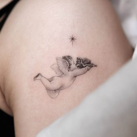 Best Baby Angel Tattoo Designs 3 Flying Cherub Tattoo, Sleeping Angel Tattoo, Cupid Tattoo Design, Angel Baby Tattoo, Tattoo Guardian Angel, Heavenly Tattoo, Cherub Tattoos, Cherubs Tattoo, Simple Angel Tattoos