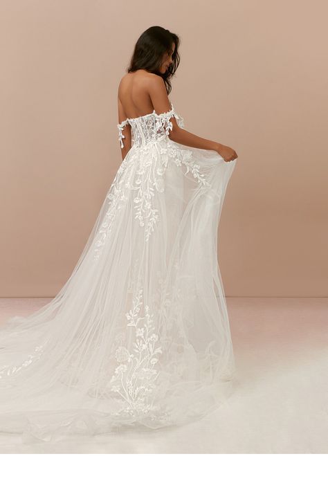 Make your guests gasp in awe as you walk down the aisle in Evergarden. She is a lace and tulle mermaid dress with a sweetheart neckline and removable off-the-shoulder straps. Her see-through illusion bodice with a dropped waistline features boning to help cinch in your waist. The dress also features a stunning removable overskirt for you to have two looks in one. Azazie Wedding Dresses, Glamorous Wedding Dress, Watters Wedding Dress, Floral Lace Wedding Dress, Contemporary Wedding Dress, Glam Wedding Dress, Trendy Party Dresses, Train Dress, Petite Wedding Dress