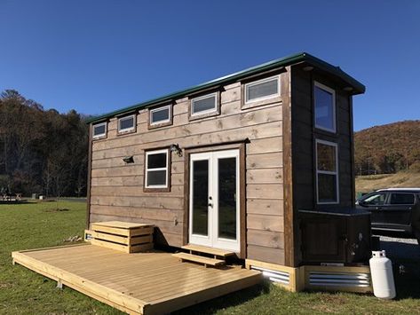 Tiny Towable with a new deck - This tiny house has a wonderful farmhouse cabin feel. I love the galvanized metal they used as skirting. - Open House at Acony Bell Tiny Home Village – Project Small House Tiny House Skirting, Tiny House Skirting Ideas, Small Bar Areas, Tiny House Tour, Skirting Ideas, House Skirting, Tumbleweed Tiny Homes, Shiplap Siding, Home Village