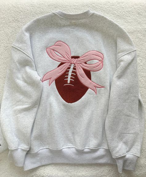 Details Brand: Sunkissed Coconut Solid Color Sweatshirt Cotton Blend Material Embroidered Small Football with Pink Bow on Front Embroidered Large Football with Pink Bow on Back Unisex Fit Crew Neckline Long Sleeves with Banded Cuffs Banded Bottom Hem Do Not Size up if you are smaller it will be to Big Do Size up if you want a Looser Fit or have a Large Chest Cut is Designed to be Larger in Mid Section but NOT Oversized Material 50% Cotton 50% Polyester Care Instructions Machine Wash Cold , Tumbl Sunkissed Coconut, Alchemy Jewelry, Umgee Clothing, Consuela Bags, Trendy Games, Patch Sweatshirt, Luxury Paints, Color Sweatshirt, Pearl Gray