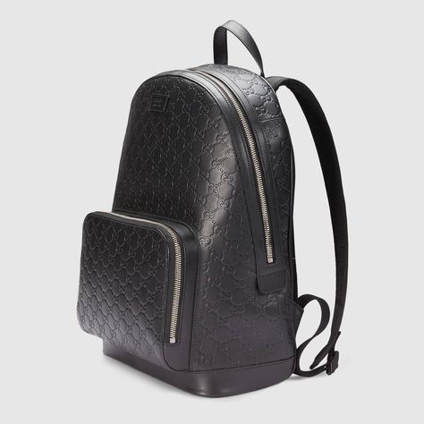 Shop the Gucci Signature leather backpack by Gucci. A classic backpack shape, featuring a front zip pocket and multiple interior pockets, including a padded tablet sleeve. Made in heat debossed Gucci Signature leather resulting in a defined print with a firm texture. Black Gucci Backpack, Mens Designer Backpacks, Gucci Backpack, Luxury Backpack, Gucci Gifts, Black Leather Backpack, Classic Handbags, Classic Backpack, Designer Backpacks