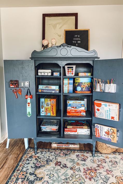 Armoire Toy Storage, Armoire In Playroom, Art Supplies Cabinet, Armoire Toy Storage Ideas, Creative Lego Storage, Art Supply Cabinet, Toy Armoire, 2023 Nursery, Art Cupboard