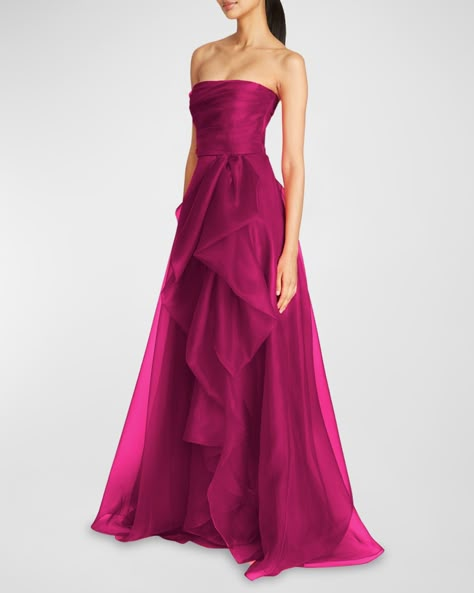 Theia "Teresa" gown with a ruffled side drape Strapless neckline Sleeveless Ruched bodice Floor-sweeping hem A-line silhouette Invisible back zipper Polyester Imported