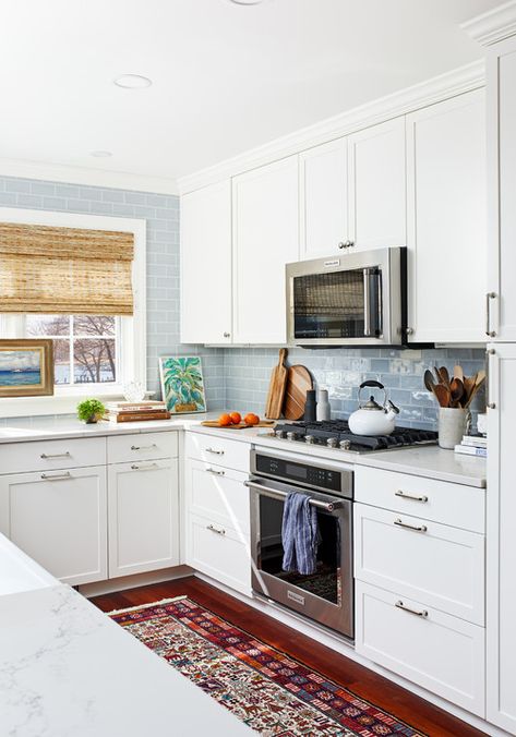 Beautiful white kitchen with pale blue subway tile Dishwasher Ideas, Kitchen Remodeling Ideas, Beautiful White Kitchens, Blue Subway Tile, Kitchen Post, Brown Floors, Scandinavian Kitchen, Transitional Kitchen, Apartment Kitchen