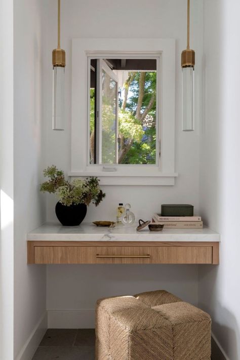 The Ainsley Stool from the @kirk_nix collection adds natural texture and comfort to this vanity nook. Its low profile makes it the perfect complement to small spaces where it can be easily tucked away when not in use.  #Palecek // @kirk_nix Collection // Design: @emerson.gracedesign // Photography: @jessicabrydsonphotograph Oak Makeup Vanity, Built In Makeup Vanity Ideas, Nook Vanity, Makeup Nook, Built In Makeup Vanity, Vanity Nook, Built In Vanity, Corner Vanity, Dining Table Lighting