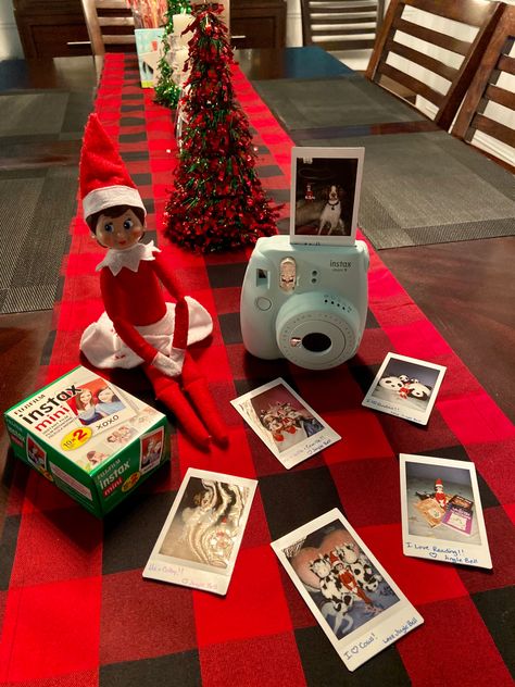 Elf On The Shelf Brings A Gift, Elf On The Shelf Camera Ideas, Elf House Ideas, Elf On The Shelf Camera, Elf Camera, Elf On The Shelf Polaroid, Elf On The Shelf Girly Ideas, Elf And Barbie Ideas, Elf On The Shelf Christmas Card Photo