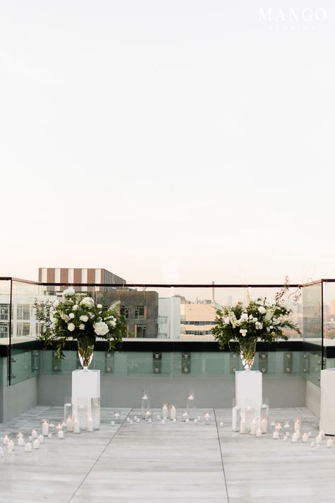 Rooftop Romance #decor #engagement #ideas #flowers #candles #romance #couple #details #elegant Rooftop Ceremony Decor, Rooftop Engagement Decoration, Minimalist Proposal Ideas, White Proposal Decor, Rooftop Wedding Ceremony Decor, Elegant Proposal Ideas, Rooftop Engagement Party, Rooftop Wedding Decor, Rooftop Romance