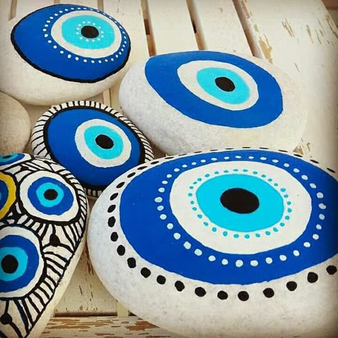 Evil Eye Rocks Painted Stones, Evil Eye Rock Painting, Evil Eye Stone, Stones For Garden, Greece Painting, Fabric Flower Headbands, Evil Eye Art, Painted Pots Diy, Stones Art