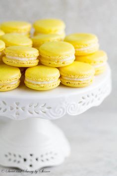 Lemon French Macarons- perfect spring-flavored confections with zesty lemon buttercream that you can make right at home with my new video tutorial!  ~ Sweet and Savory by Shinee Yellow Macaroons, Lemon Macarons, Lemon Buttercream, Macaroon Recipes, Macaron Recipe, French Macarons, Lemon Desserts, Lemon Recipes, White Cake