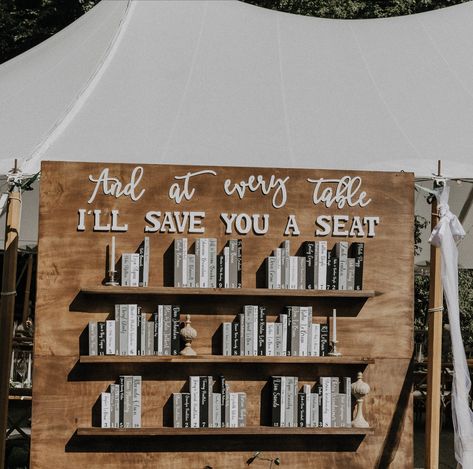 Bookish Seating Chart, Book Store Proposal, Incorporating Books In Wedding, Wedding Book Favors, Wedding Table Assignment Ideas Reception Seating, Book Table Seating Chart, Books As Wedding Favors, Bookcase Wedding Seating Chart, Book Favors Wedding