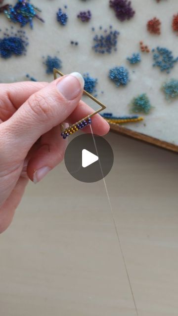 Mile High Beads ~ Kari on Instagram: "A quick look at how I attach the beads to the frame for my Art Deco Fringe Earrings. 🪡   Not only was I lucky enough to get to send out a pair of Art Deco Fringes yesterday, but I have another pair on my Orders-To-Make List, too! 🤗 Thank you so much for keeping me busy! 💓 . . . . . . . . . . . . . #seedbeads #seedbeadjewelry #beadweaving #jewelrymakers #seedbeadearrings #fringeearrings #milehighbeads #makingjewelry #jewelrymakingprocess #processvideo" How To Make Beaded Fringe Earrings, How To Make Fringe Bead Earings, How To Make Fringe Earrings, Diy Beaded Hoop Earrings Tutorials, Fringe Beaded Earrings Tutorial, Fringe Earrings Diy Tutorials, Seed Bead Fringe Earrings Tutorial, Bead Fringe Earrings Tutorial, Diy Seed Bead Earrings Tutorials