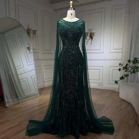 Be the highlight of the night.💚 Illuminate at www.larosabride.com #NightHighlight #IlluminatedElegance #larosabride Gown With Cape, Beaded Cape, Mermaid Evening Gown, Black Mermaid, Green Mermaid, Cape Sleeves, Mermaid Evening Dresses, Feather Dress, Mermaid Gown