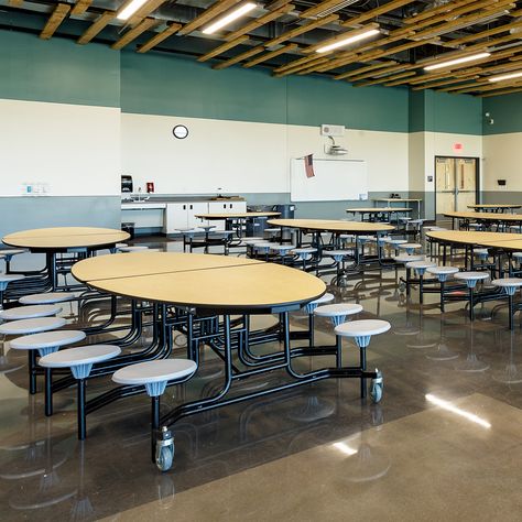 The cafeteria at Grand View Elementary features mobile NPS folding cafeteria tables for a comfortable and communal space for students during their break. They're attractive, durable, functional, and customizable, and a great choice for any busy lunchroom! Explore the full range >>  Pictured: MTR-608MP - NPS Round Cafeteria Table - MDF Core, ProtectEdge, 8 Stools. MET-126 - NPS Oval Cafeteria Table - MDF, ProtectEdge, 12 Stools  Photo Credit: Darren Gouge #SchoolFurniture #SchoolCafeteria Shifting Subliminal, High School Lunches, School Animation, School Lunchroom, High School Plan, Communal Space, Cafeteria Design, Cafeteria Table, School Tables