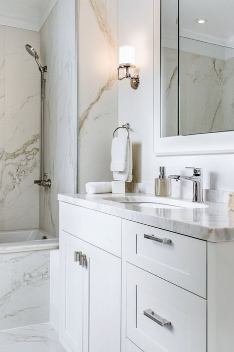 Add bold marble accents for a luxurious bathroom look. #MarbleBathroom #BoldInteriors #LuxuryDecor Bathroom With Quartz Countertop, Arabescato Marble Bathroom, Marble In Bathroom, Bathroom Design Marble, Bathrooms Marble, Marble Countertops Bathroom, Bold Marble, Arabescato Marble, Countertops Bathroom