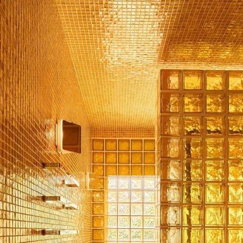 Interior Social Club on Instagram: "An amber glass-block bathroom ✨  What do you think of this bathroom design?  Design: @ch_herrero  📸:  •  ⠀⠀⠀⠀⠀⠀⠀⠀⠀ •  • #chherrero #glassblock #glassblockdesign #bathroomdesign #bathroominspiration #bathroominterior #yellowbathroom #interiorsocialclub" Colored Glass Block Wall, Shower With Glass Block Window, Glass Block Interior, Glass Block Bathroom, Colored Glass Block, Glass Block Shower Wall, Glass Block Shower, Glass Blocks Wall, Deep Tub