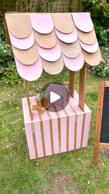 Vicky B on Instagram: "ad🍦There’s so much imagination to be had with a humble cardboard box!

I’ve worked with @beyondtheboxuk to share how this Father’s Day rather than giving a gift why not create something that provides endless imaginative play with your little ones. 
Giving moments that they’ll treasure forever with their dad and grandad 🫶🏻

To make this icecream stand I used one large box that I painted in leftover paint. I then added four cardboard supports and an a-frame for the roof that I covered in scalloped tiles 🌸

For the icecream I used an old cardboard tube cut up and then painted eggcup holders in icecream colours 🍦

Cardboard is strong, reliable and usually just thrown away but there are so many things you could make, you just need to use your imagination 🌸🍦🫶🏻💗 Big Cardboard Boxes, Scallop Tiles, Cardboard Creations, House Planter, Cardboard Box Crafts, Big Bertha, Cardboard Frame, Leftover Paint, Picture Boxes