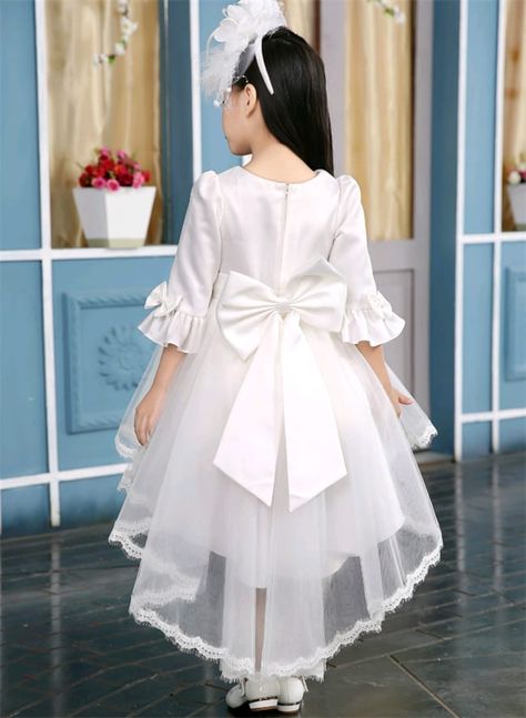 A baby girl's tail frock is a dainty and elegant dress designed with soft, high-quality fabrics, often featuring a longer back hem for a graceful, flowing effect. These frocks come in various colors and exquisite styles, adding a touch of sophistication to special occasions, making your little one look like a charming fairy tale princess. Tail Frocks, Tail Frock, Frock For Kids, Frocks For Kids, High Low Dress, High & Low, Flower Girl, Flower Girl Dresses